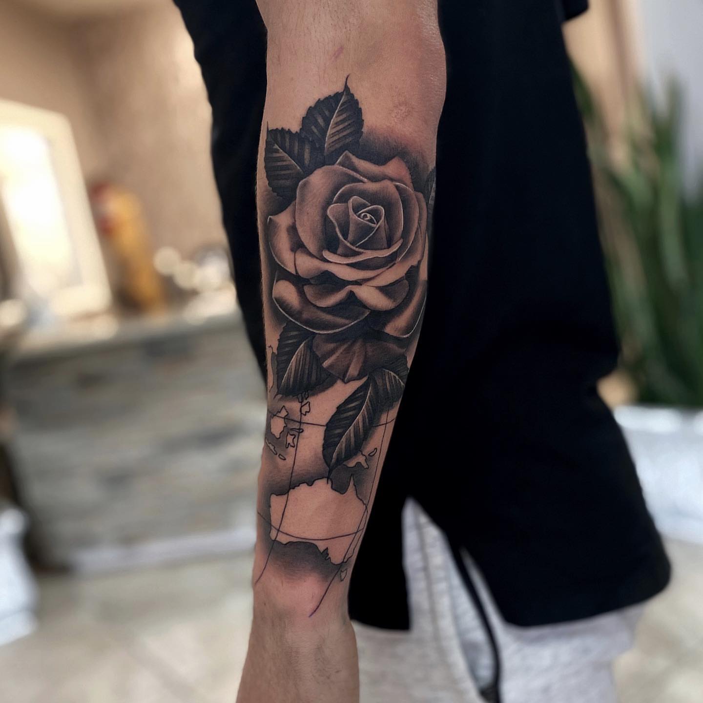 Rose black and grey tattoo on the forearm by Aaron Carey, Salem, Oregon