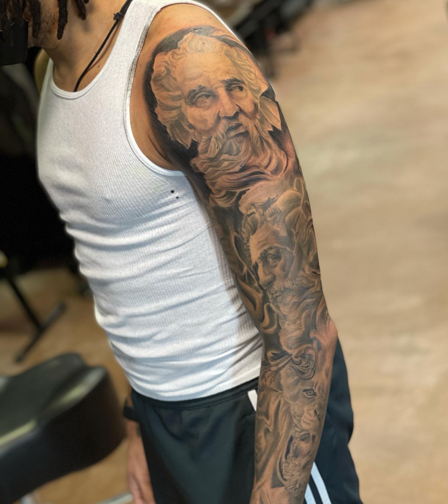 Bearded man realism tattoo on the upper arm by Mikeyftsk2
