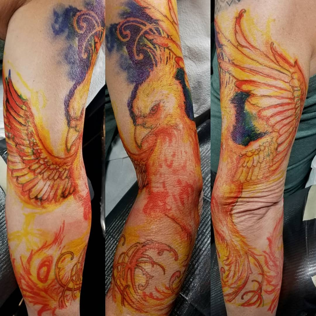 Phoenix watercolor tattoo on the forearm by Jake Goss, Salt Lake City, Utah