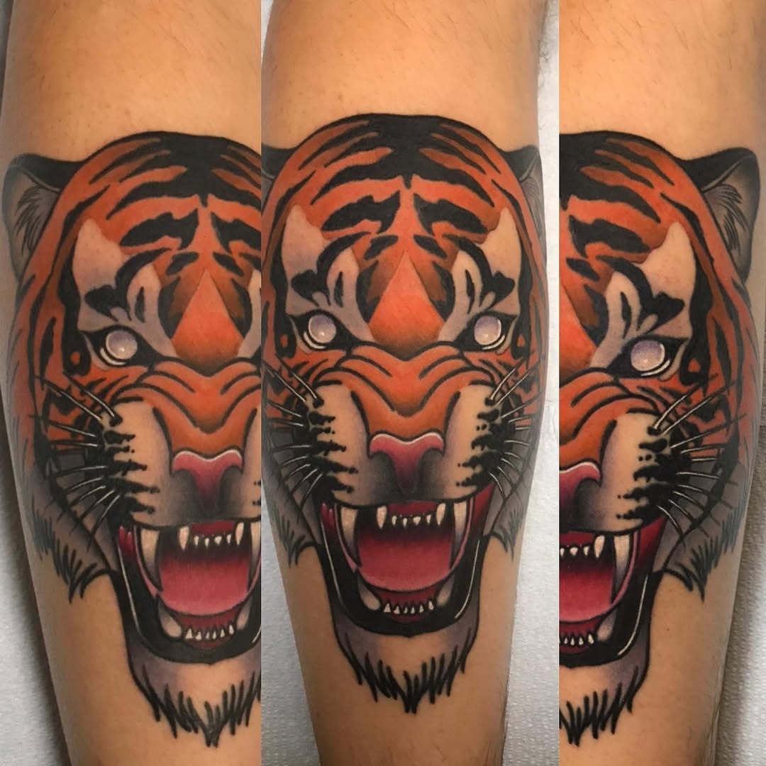 Tiger head realism tattoo on the forearm by Mike D