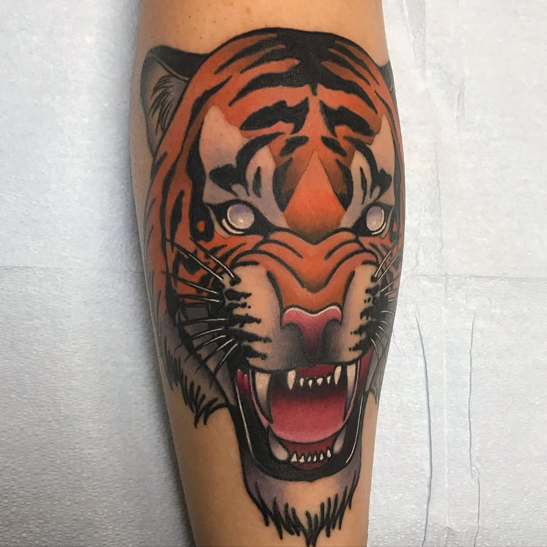 Tiger head realism tattoo on the forearm by Mike D