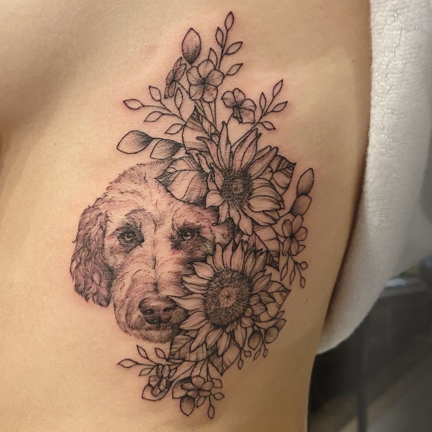 Tattoo by @emily.tattoos — realism, dotwork