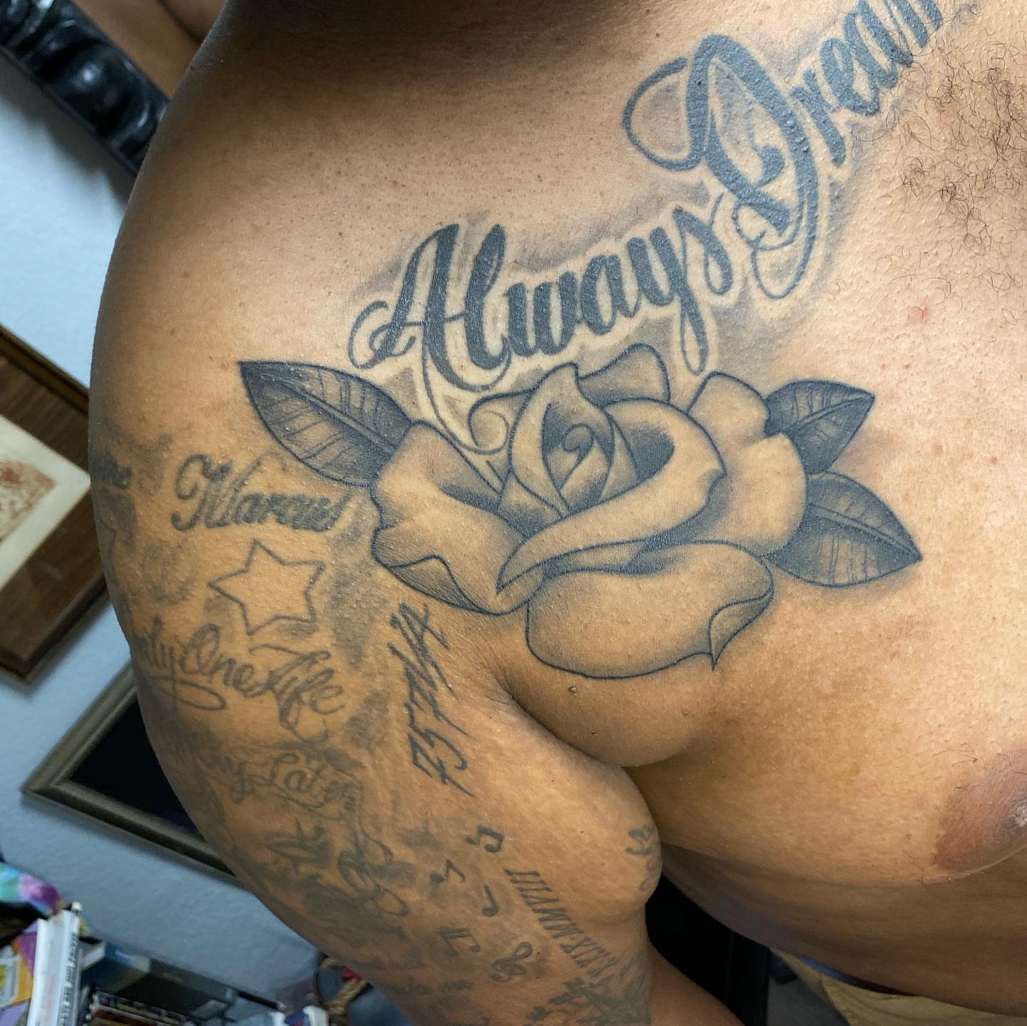 Rose black and grey tattoo on the thigh by Dustin Lane Collins