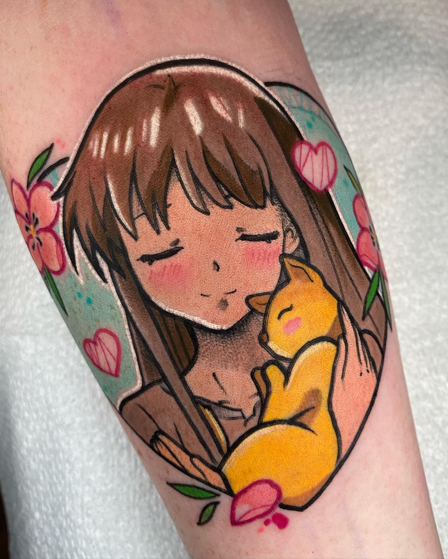 Girl hugging cat anime tattoo on the forearm by Kara Klenk