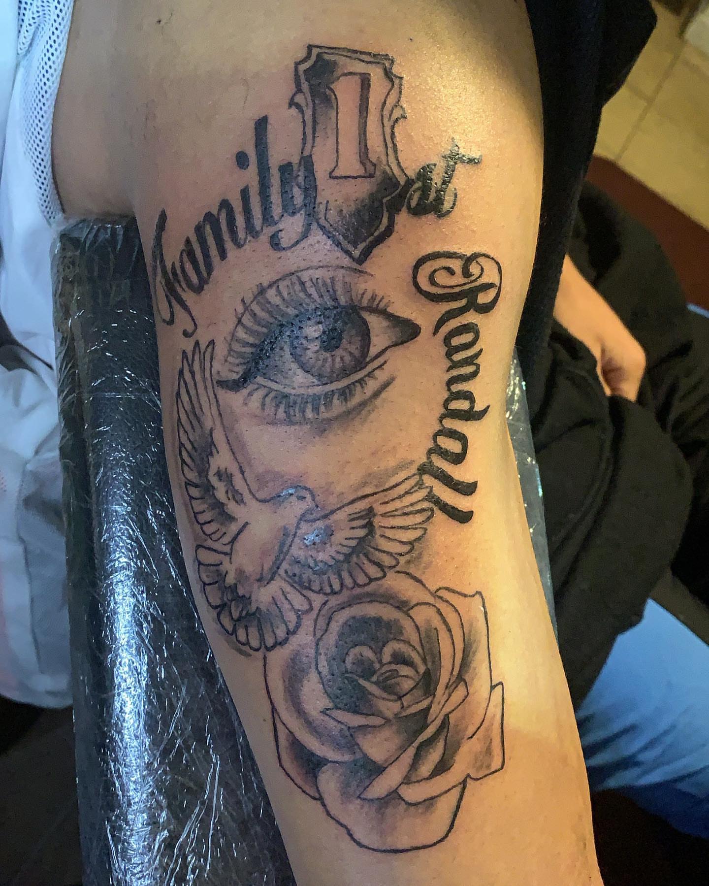 Eye and dove realism tattoo on the forearm by groovyyinkss