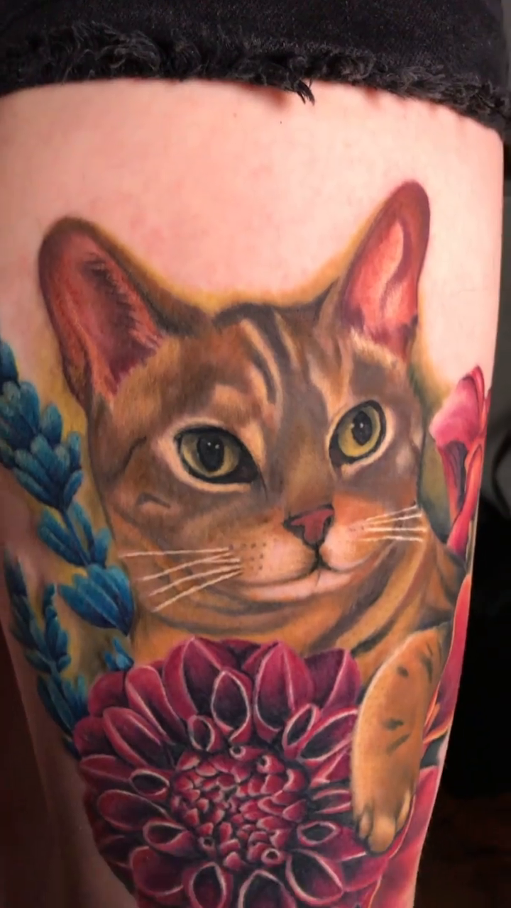 Cat with flowers realism tattoo by Austin tattoo artist