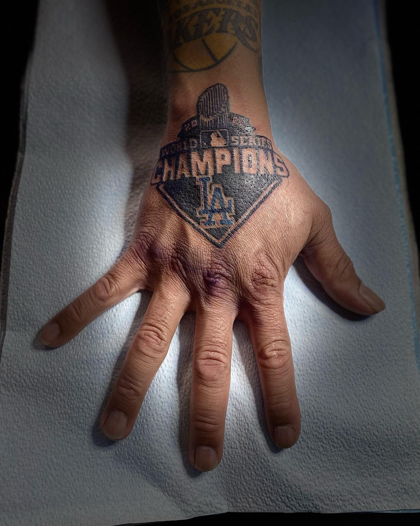 World series champions black and grey tattoo on the hand by Felix perez (Tattooer)