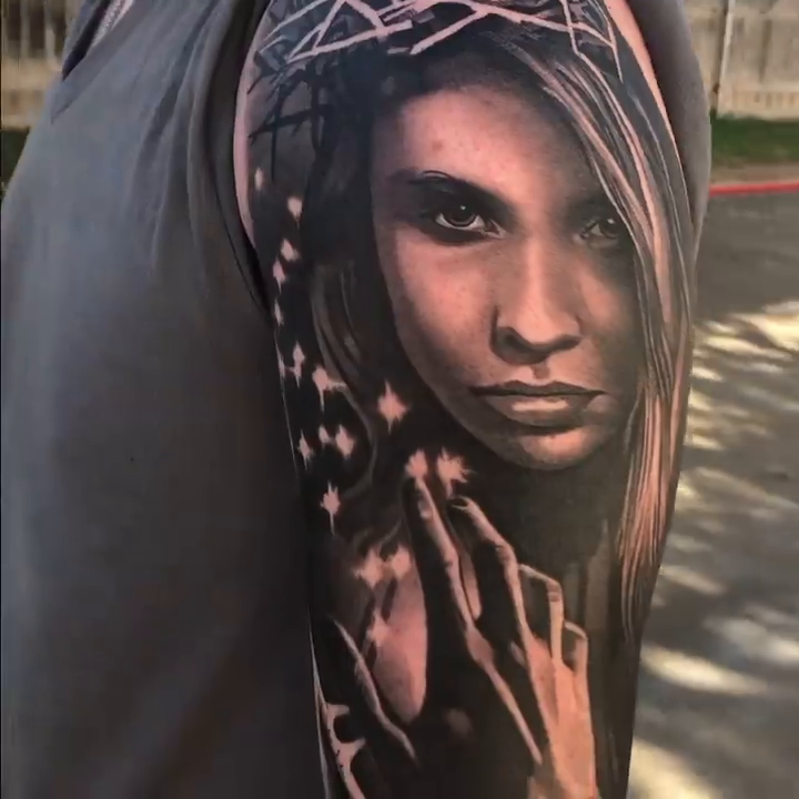 Woman and crown of thorns realism tattoo by Travis Chick