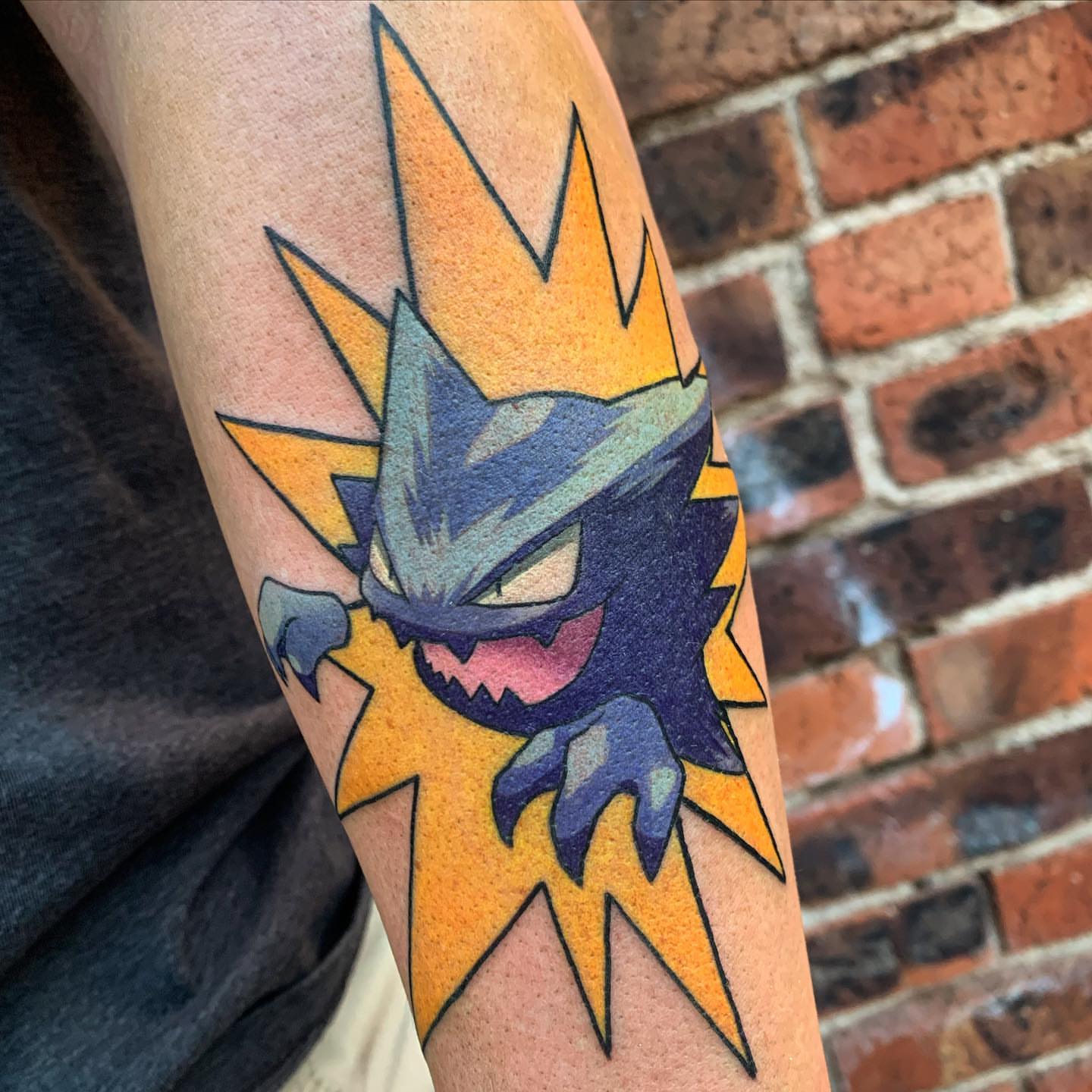 Gengar geometric tattoo on the forearm by Ben Viamontes