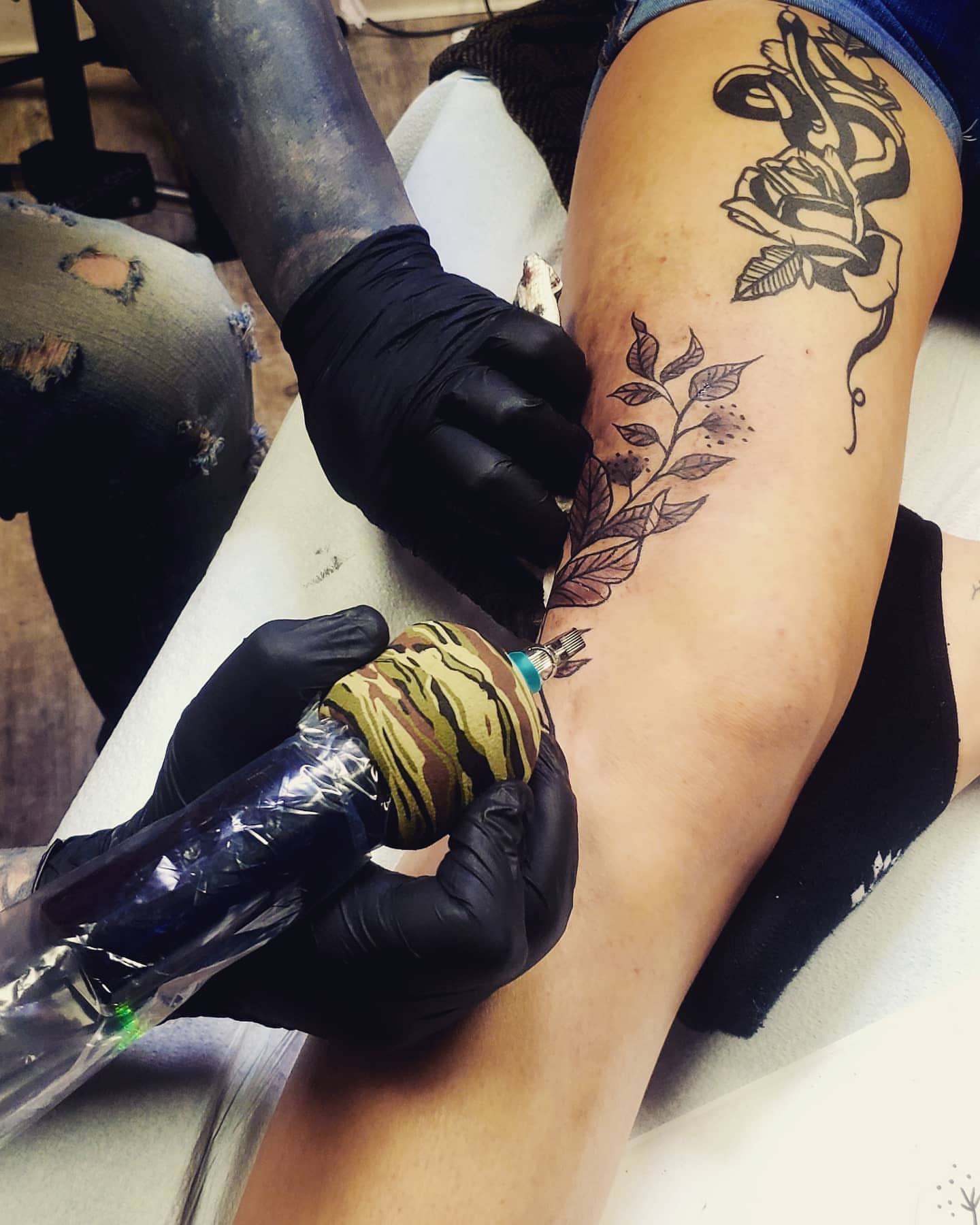 Rose and leaves black and grey tattoo on the thigh by Nadine ☥