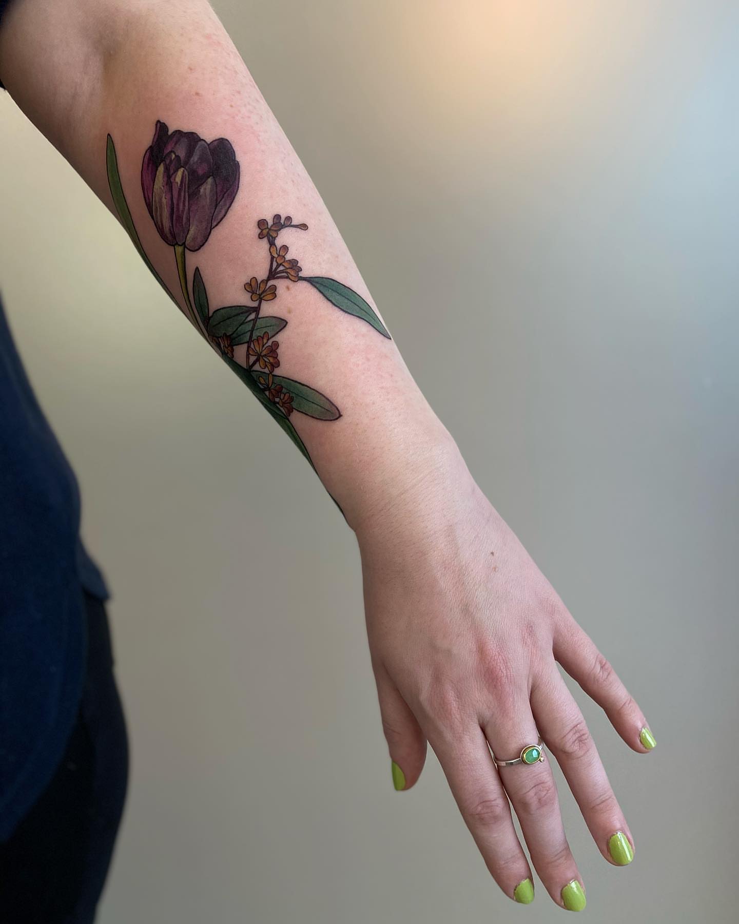 Tulip and flowers realism tattoo on the forearm by Rusty Indigo