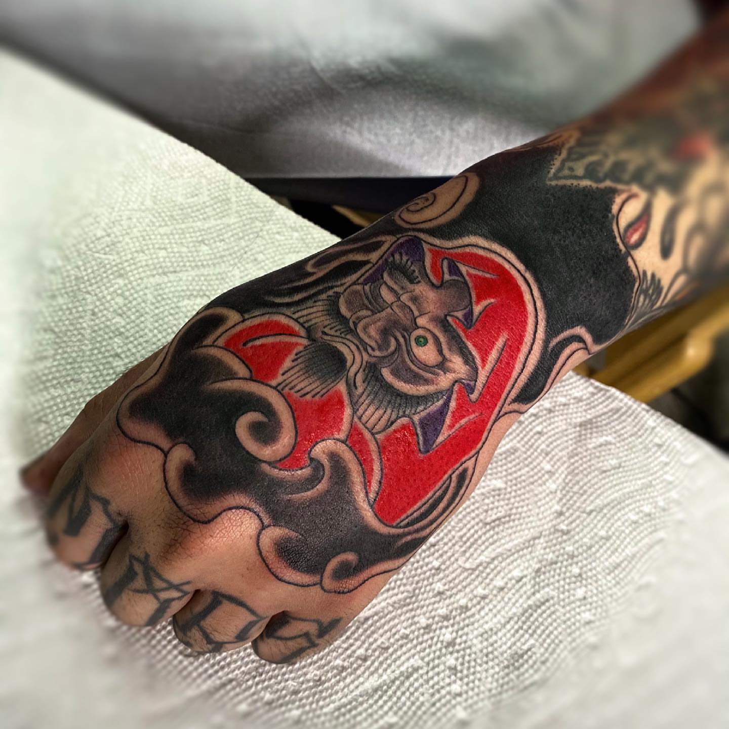 Demon American traditional tattoo on the hand by Daniel Gutierrez