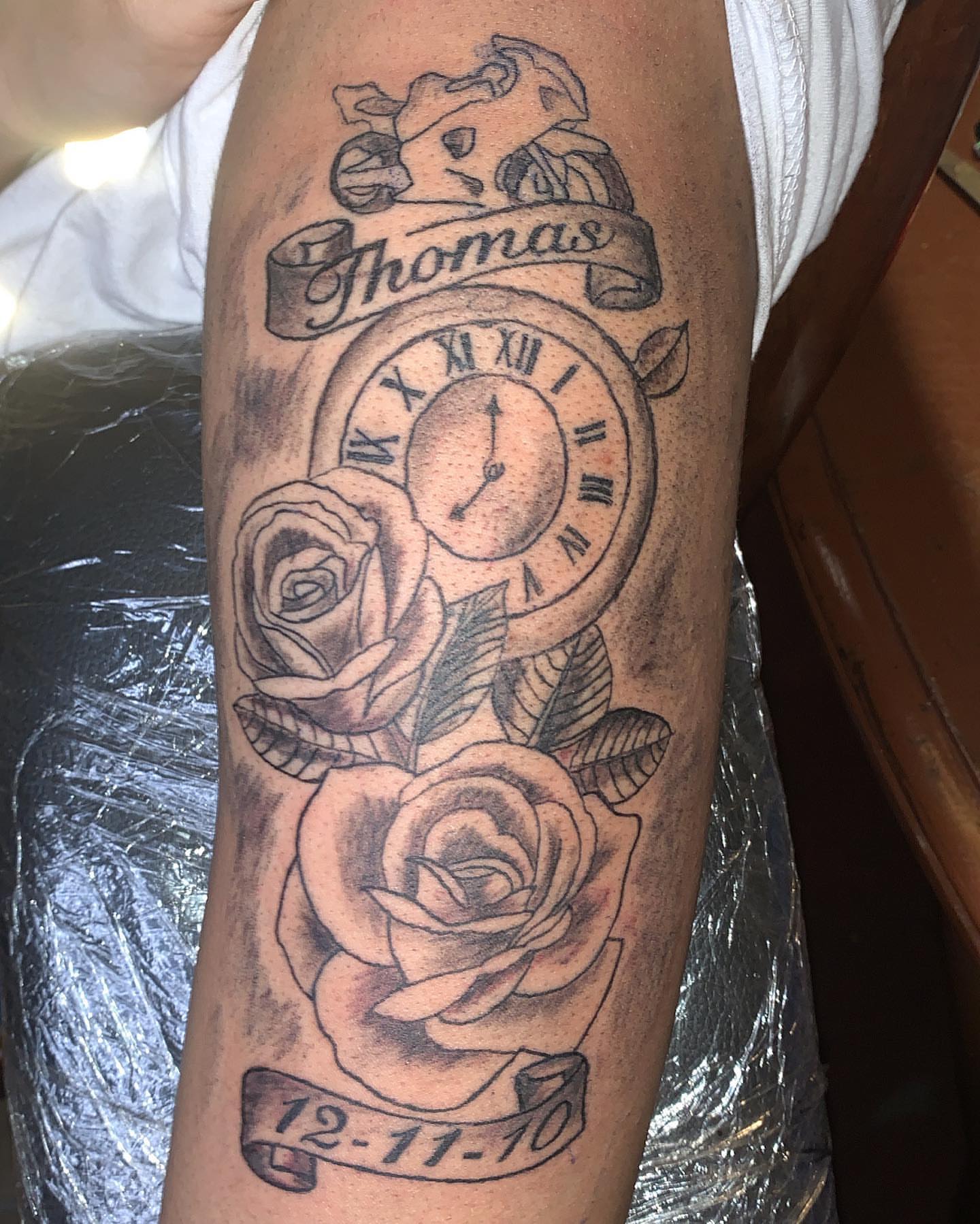Clock and roses black and grey tattoo on the forearm by groovyyinkss
