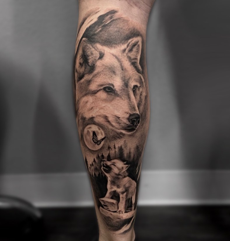 Wolf and pup realism tattoo on the forearm by Madison Ast Tattoo