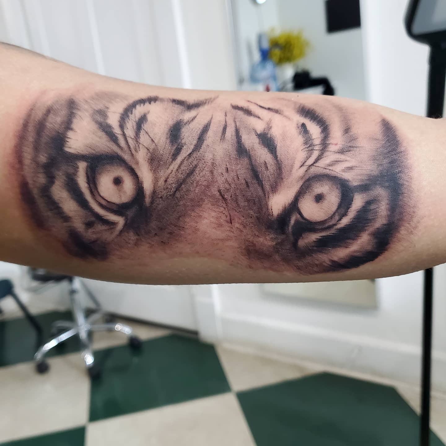 Tiger eyes realism tattoo on the forearm by David Nash, Evansville, Indiana