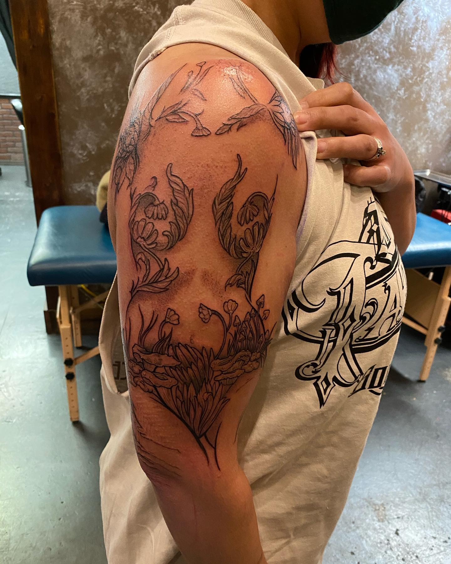 Floral design black and grey tattoo on the shoulder by Valen Laska