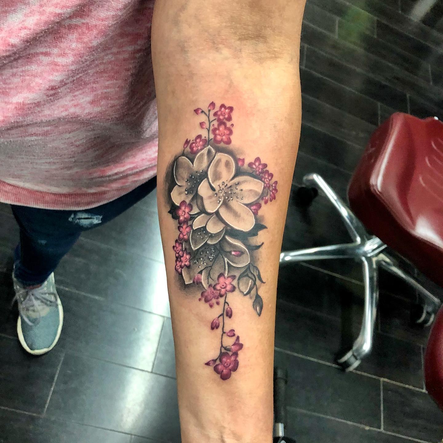 Cherry blossoms realism tattoo on the forearm by Tattoos by Rey G.