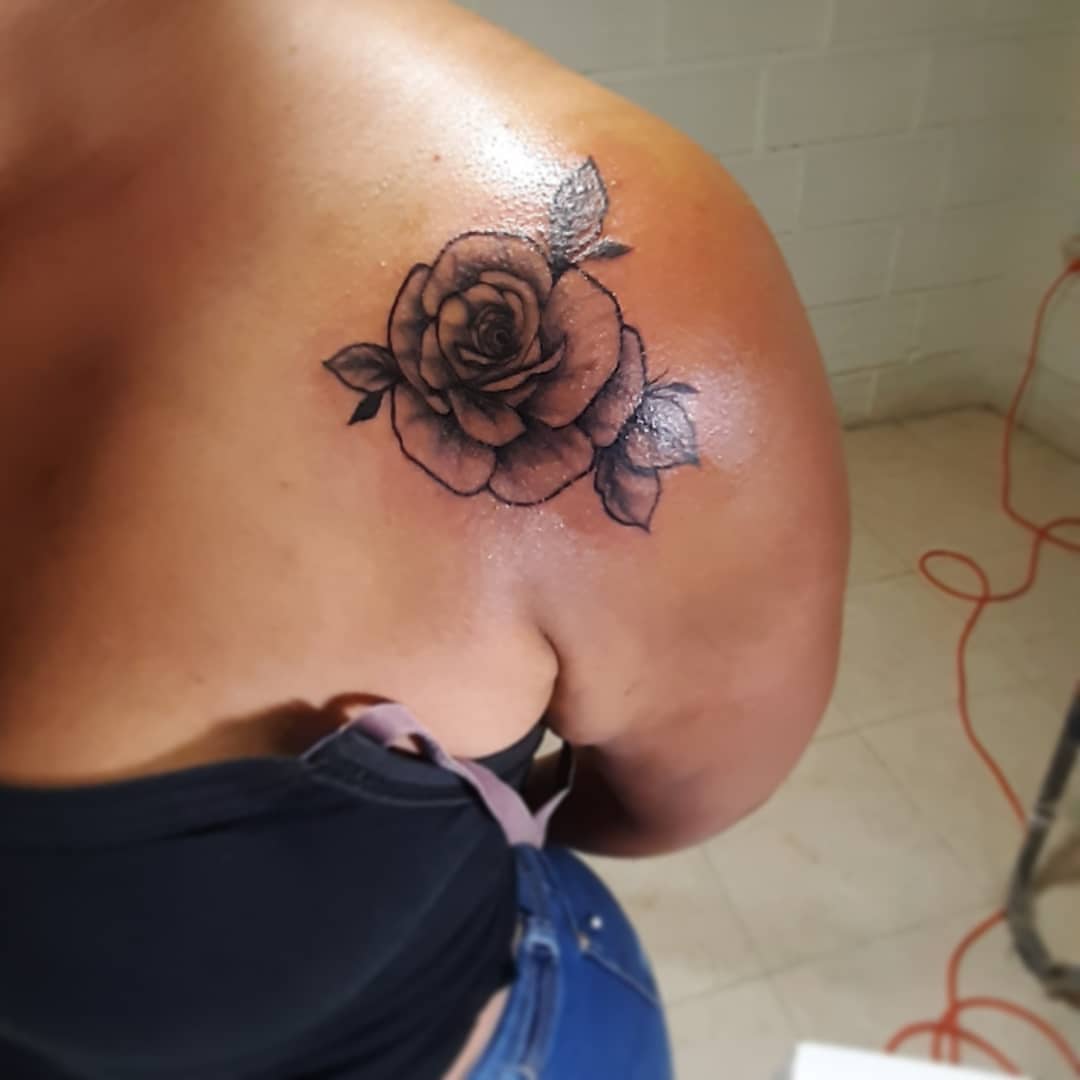 Rose black and grey tattoo on the shoulder by Erasmo Vasquez
