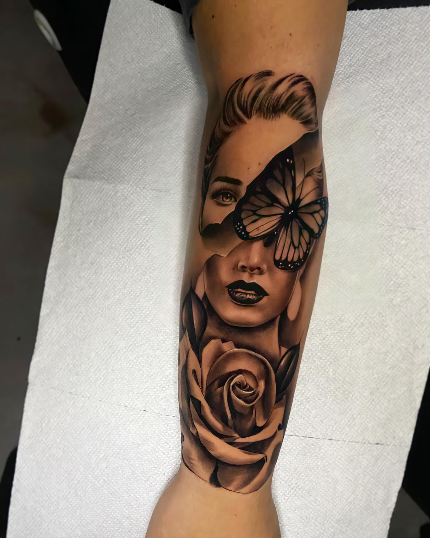 Woman with butterfly realism tattoo on the forearm by Ivan Guadalupe guzman