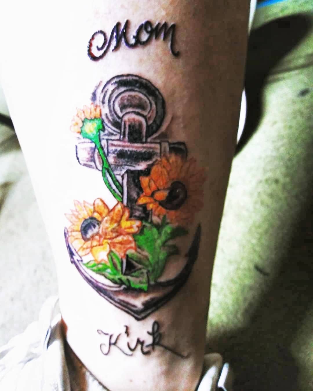 Anchor with sunflowers American traditional tattoo on the forearm by Louie Vee Guddah