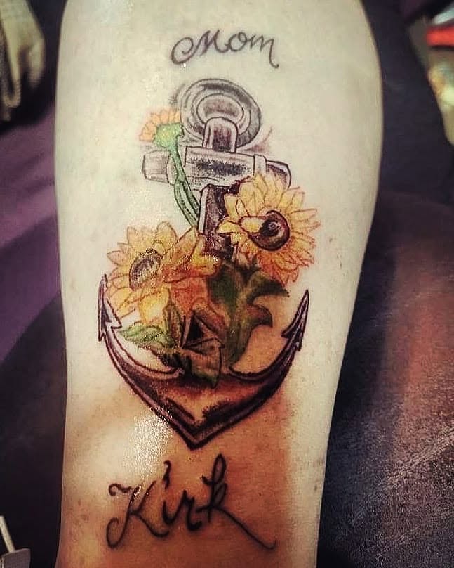 Anchor with sunflowers American traditional tattoo on the forearm by Louie Vee Guddah