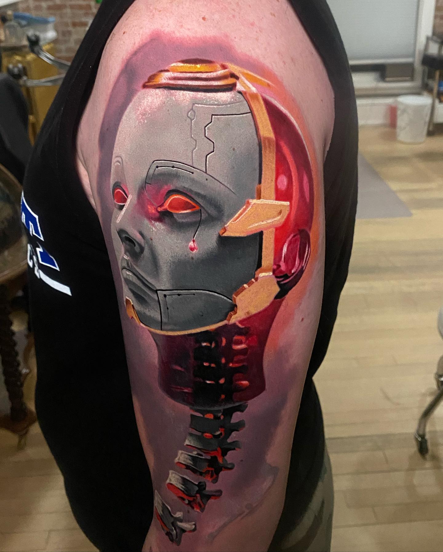 Cyborg head realism tattoo on the upper arm by Jacob Sheffield, Grand Junction, Colorado