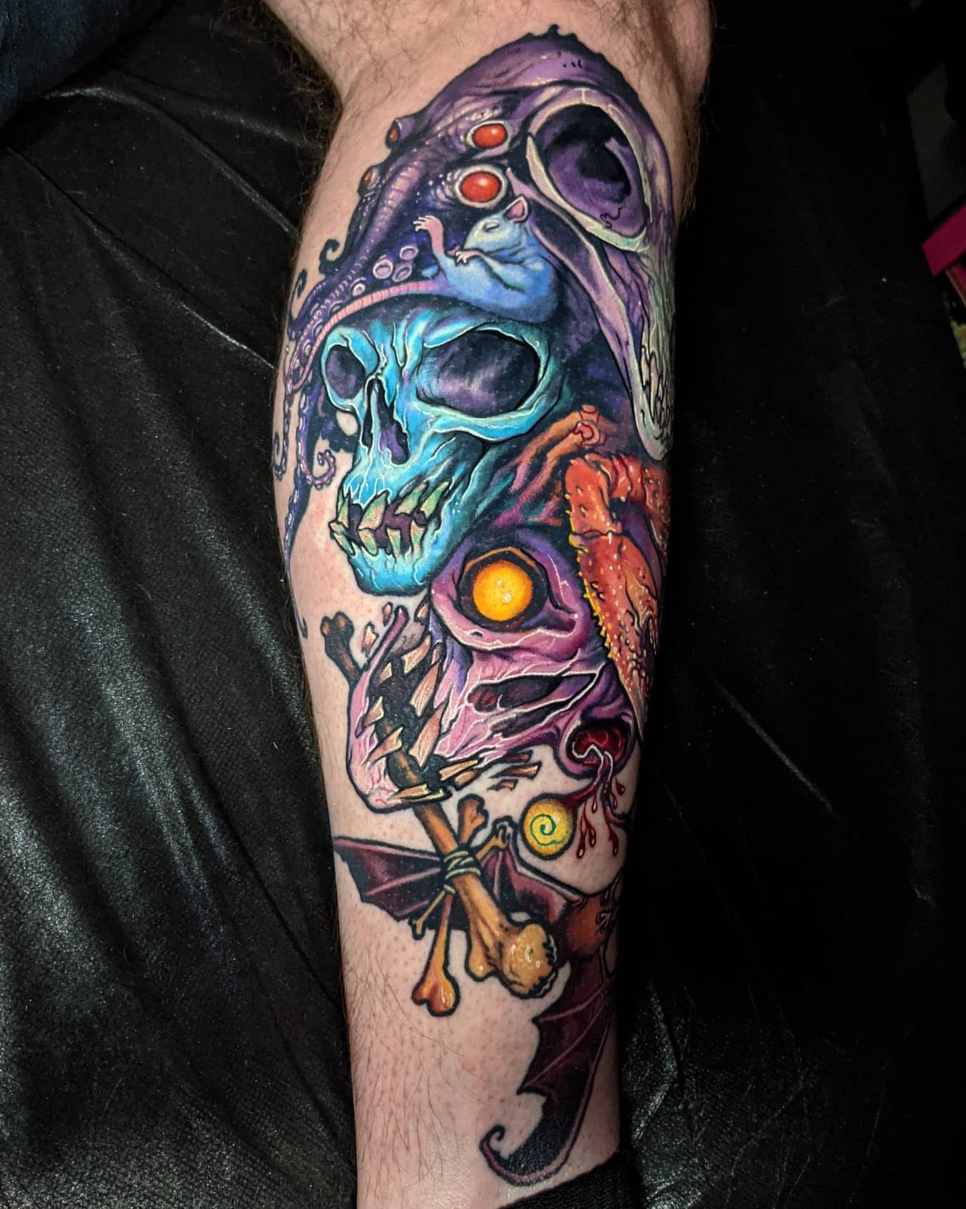 Surrealistic skull surrealism tattoo on the forearm by Matt Driscoll
