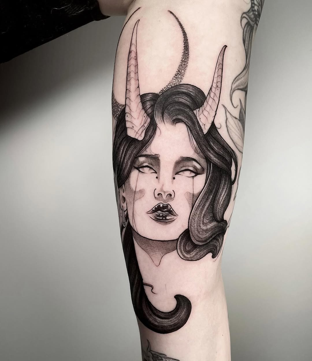 Demon woman with horns and moon realism tattoo on the forearm by Angelo Buonanno, Las Vegas, Nevada