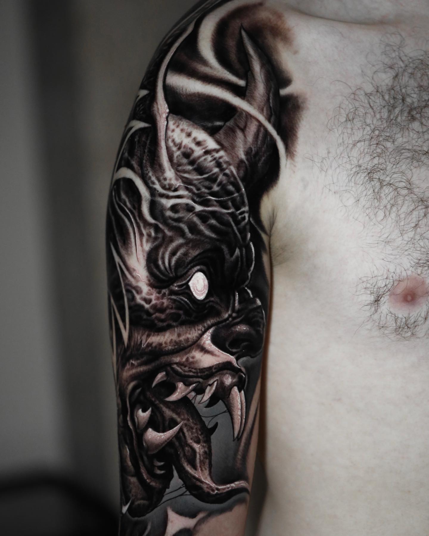 Demon realism tattoo on the forearm by Victor Portugal Tattoo