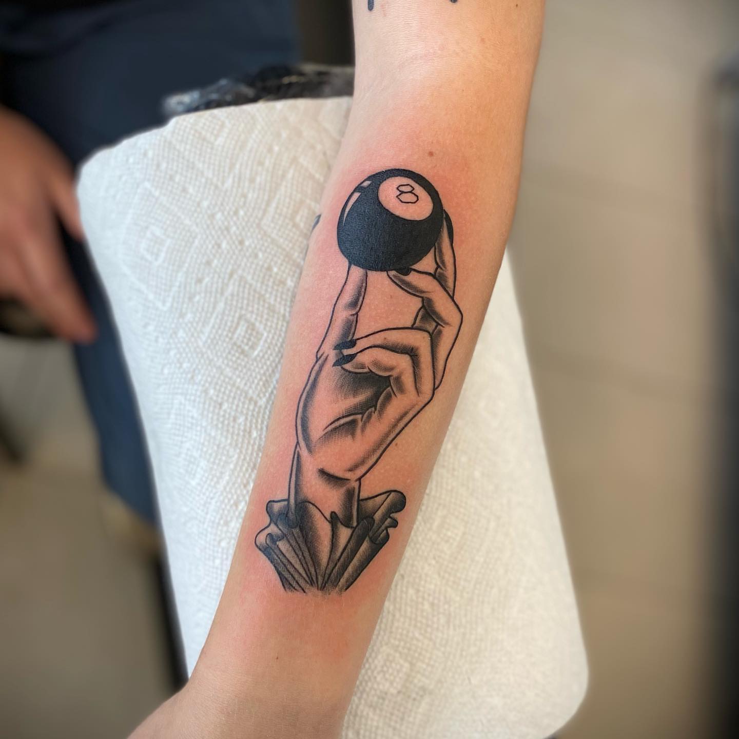 Billiard ball black and grey tattoo on the forearm by Christopher McGlone