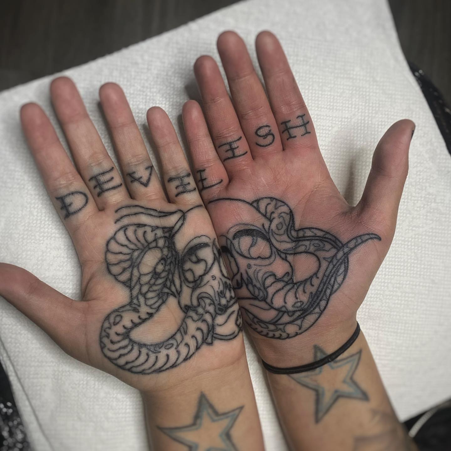 Snake black and grey tattoo on the hand by Mark Walker