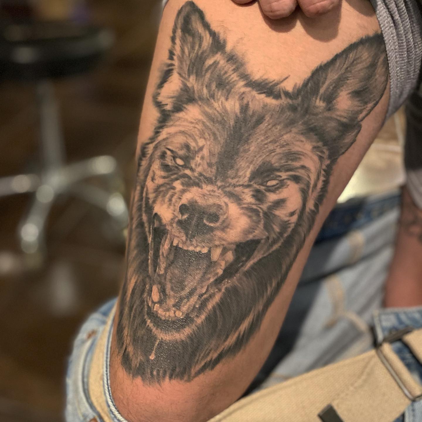 Wolf realism tattoo on the forearm by Amber