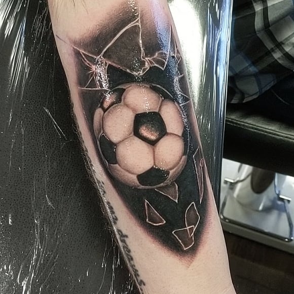 Soccer ball realism tattoo on the forearm by Douglas
