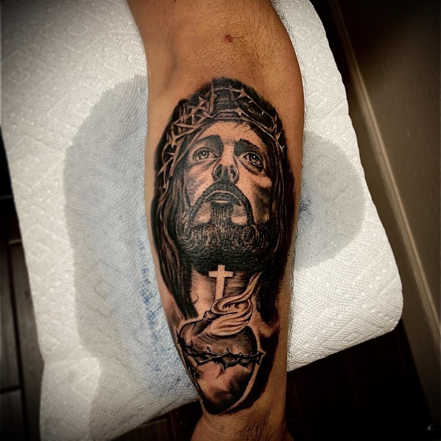 Jesus Christ realism tattoo on the forearm by Cj Hurtado