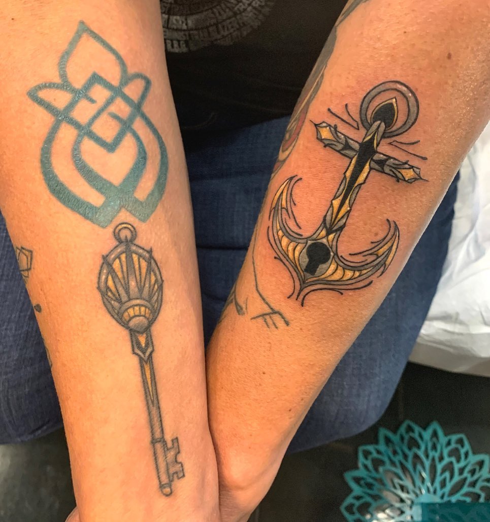 Key and anchor black and grey tattoo on the forearm by Cortney Norton