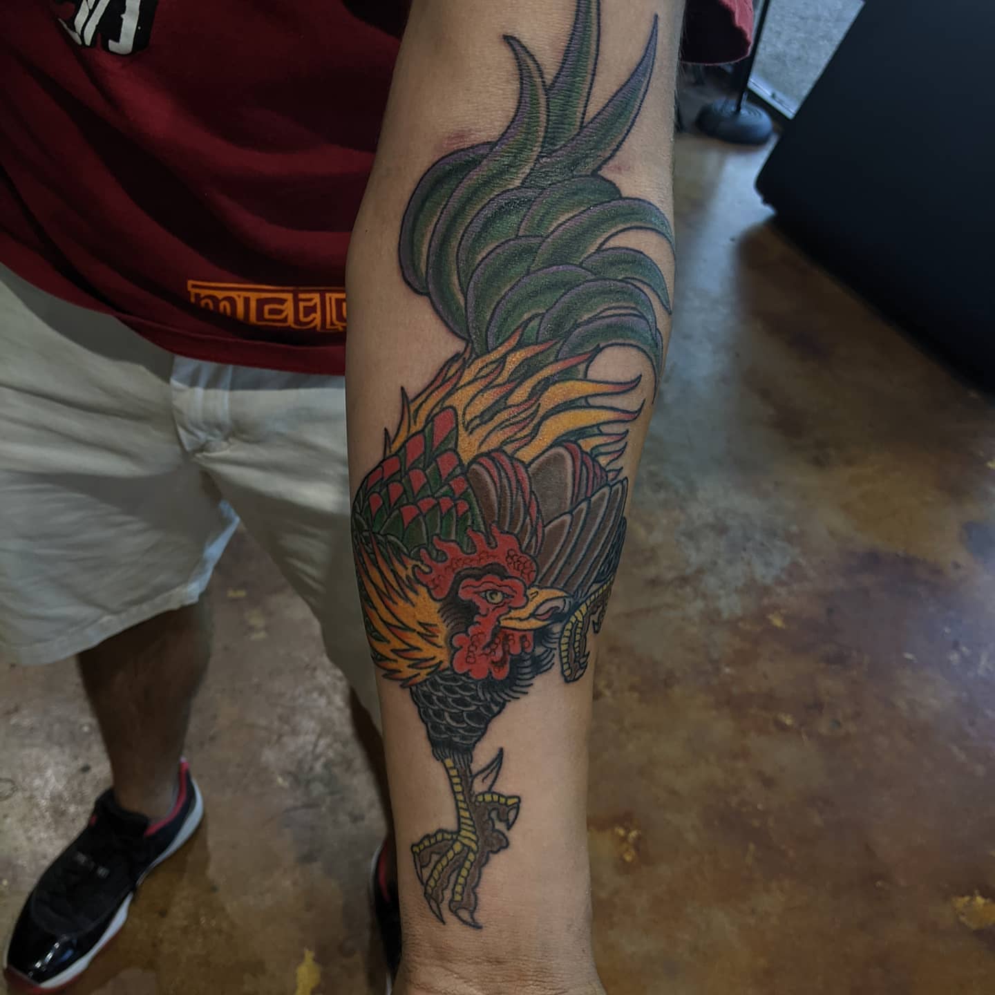 Rooster American traditional tattoo on the forearm by Rue McLean