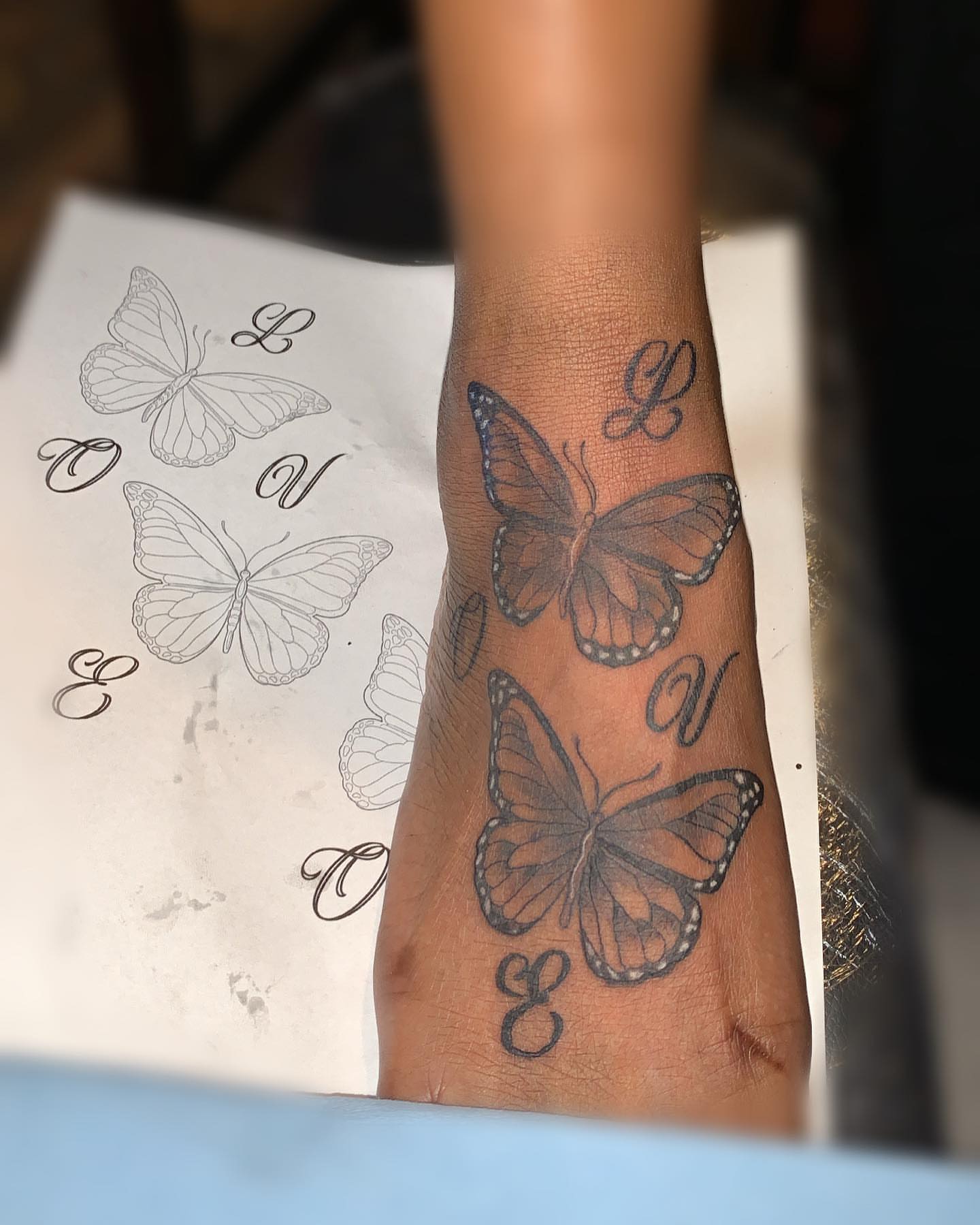 Butterfly black and grey tattoo on the forearm by groovyyinkss