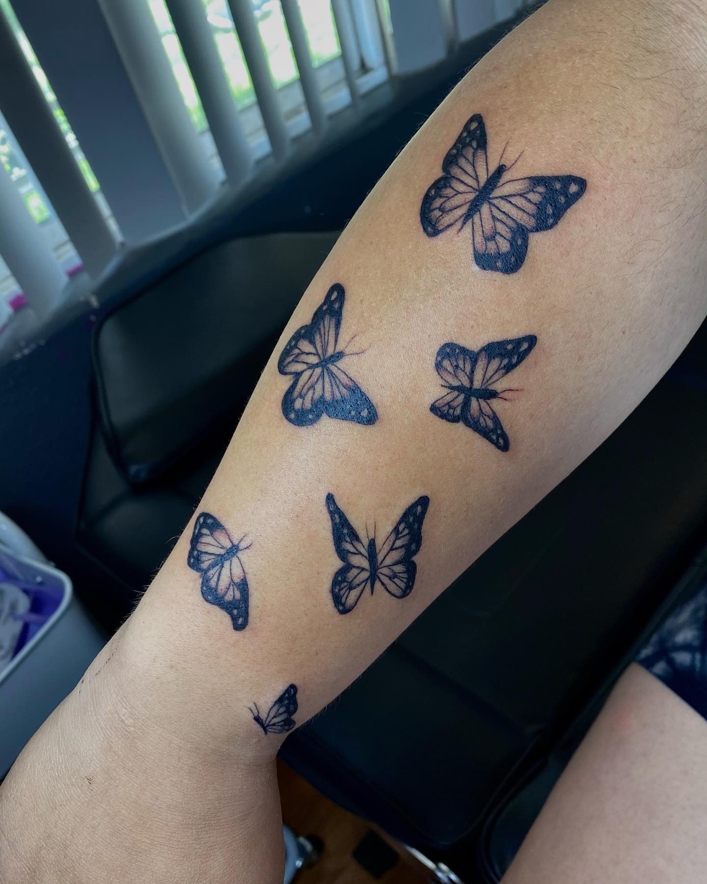 Butterflies black and grey tattoo on the forearm by Steph π€