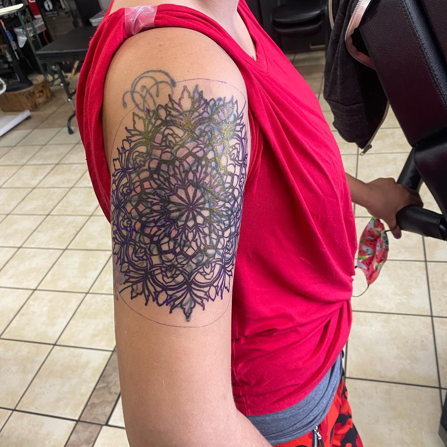 Mandala geometric tattoo on the upper arm by Nicholas Jones