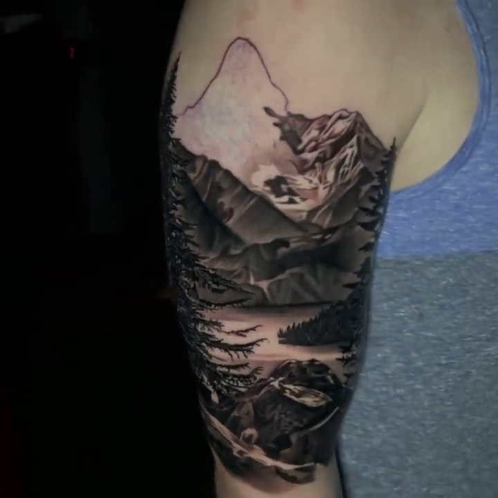 Mountain landscape with trees and lake realism tattoo by Travis Chick