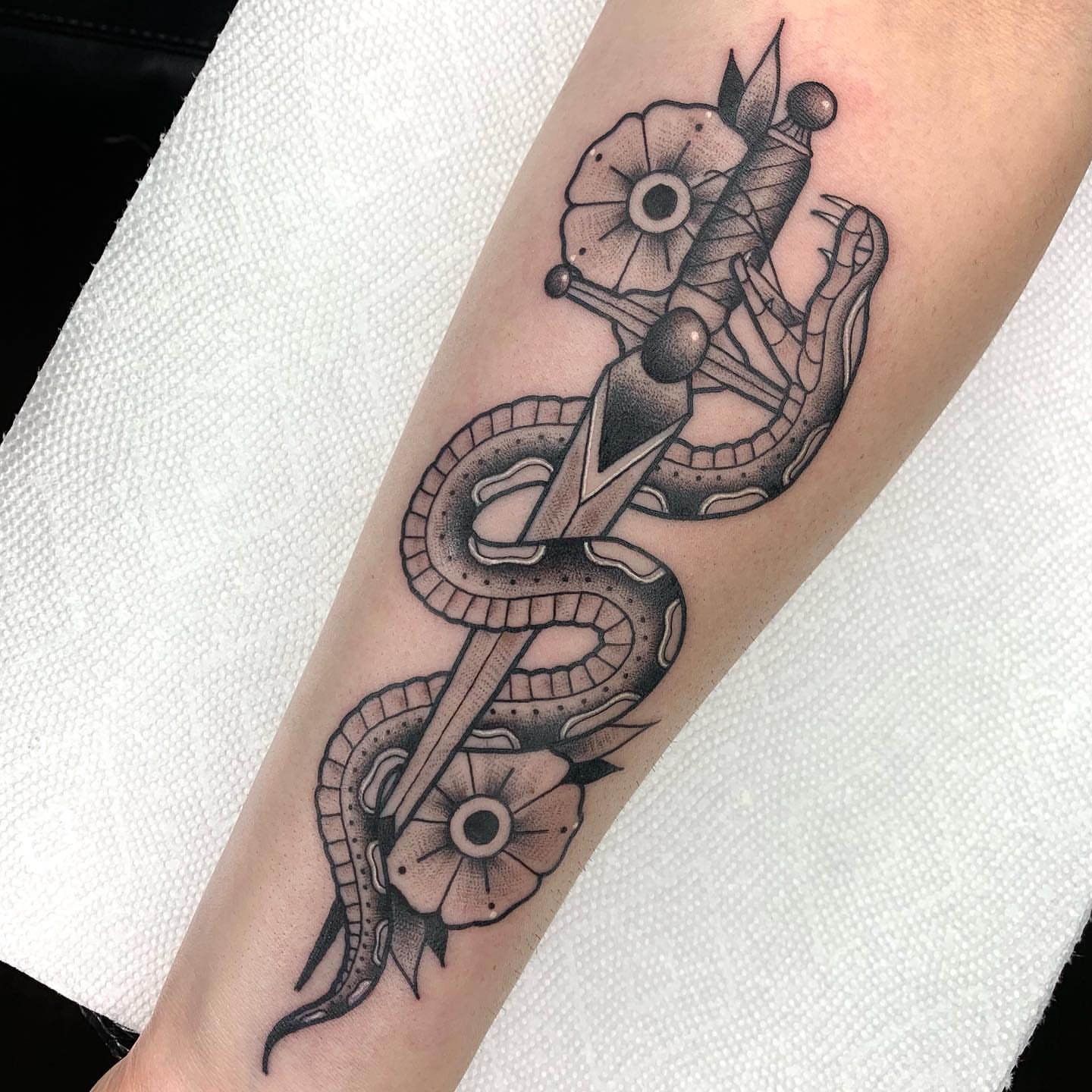 Snake and peony dotwork tattoo on the forearm by Luis Torres, Harrison, New Jersey