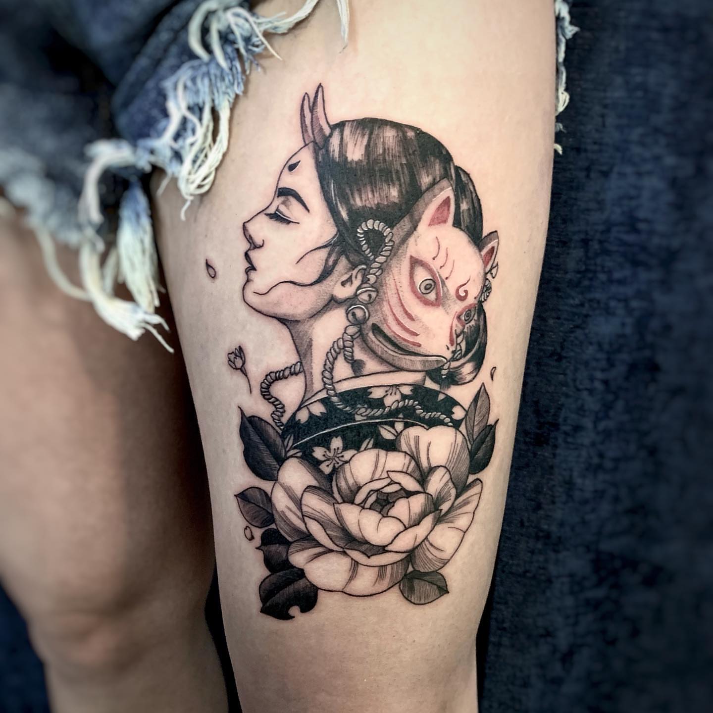 Woman with demon American traditional tattoo on the thigh by Binn Binn - Houston Tattoo Artist
