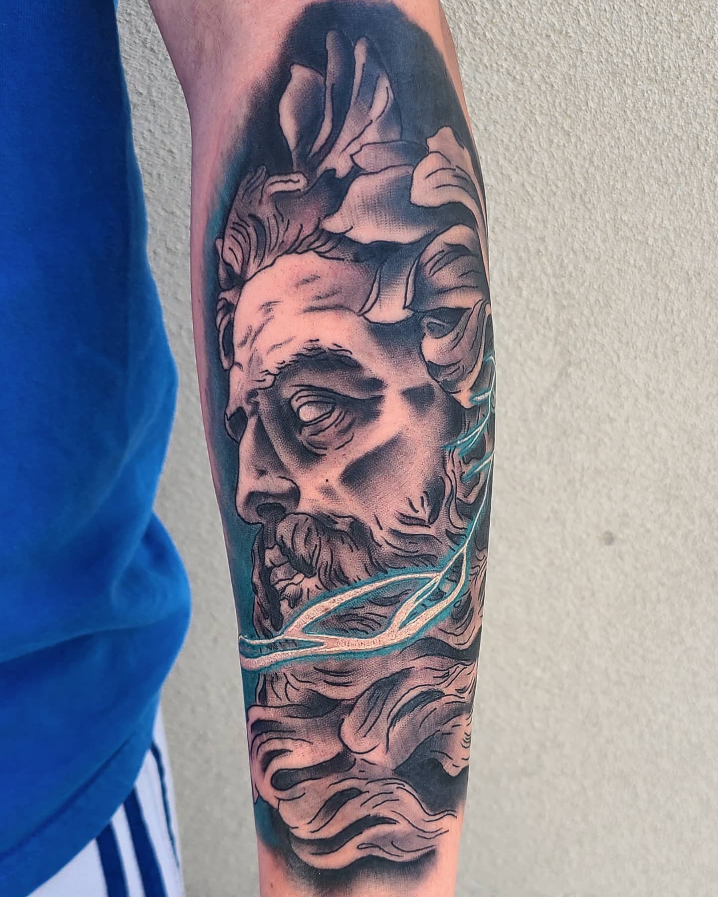God-like figure realism tattoo on the forearm by ๐๐ฌ๐ฐ๐ฅ ๐๐ฌ๐ฌ๐ซ