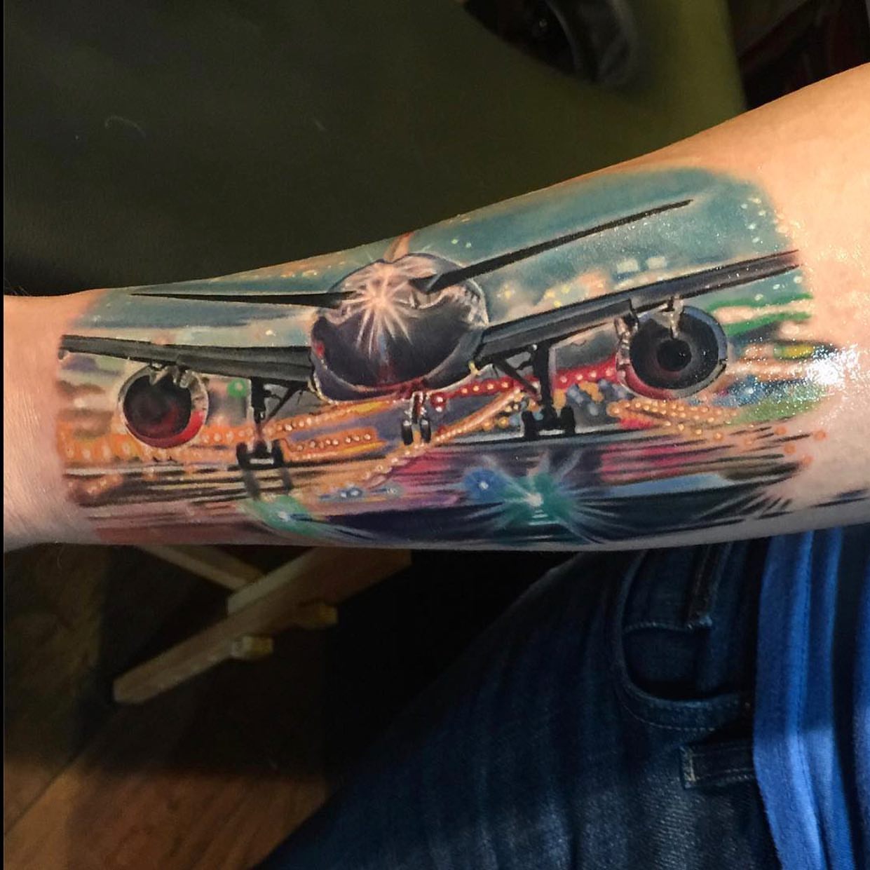 Biplane realism tattoo on the forearm by Gary Graves