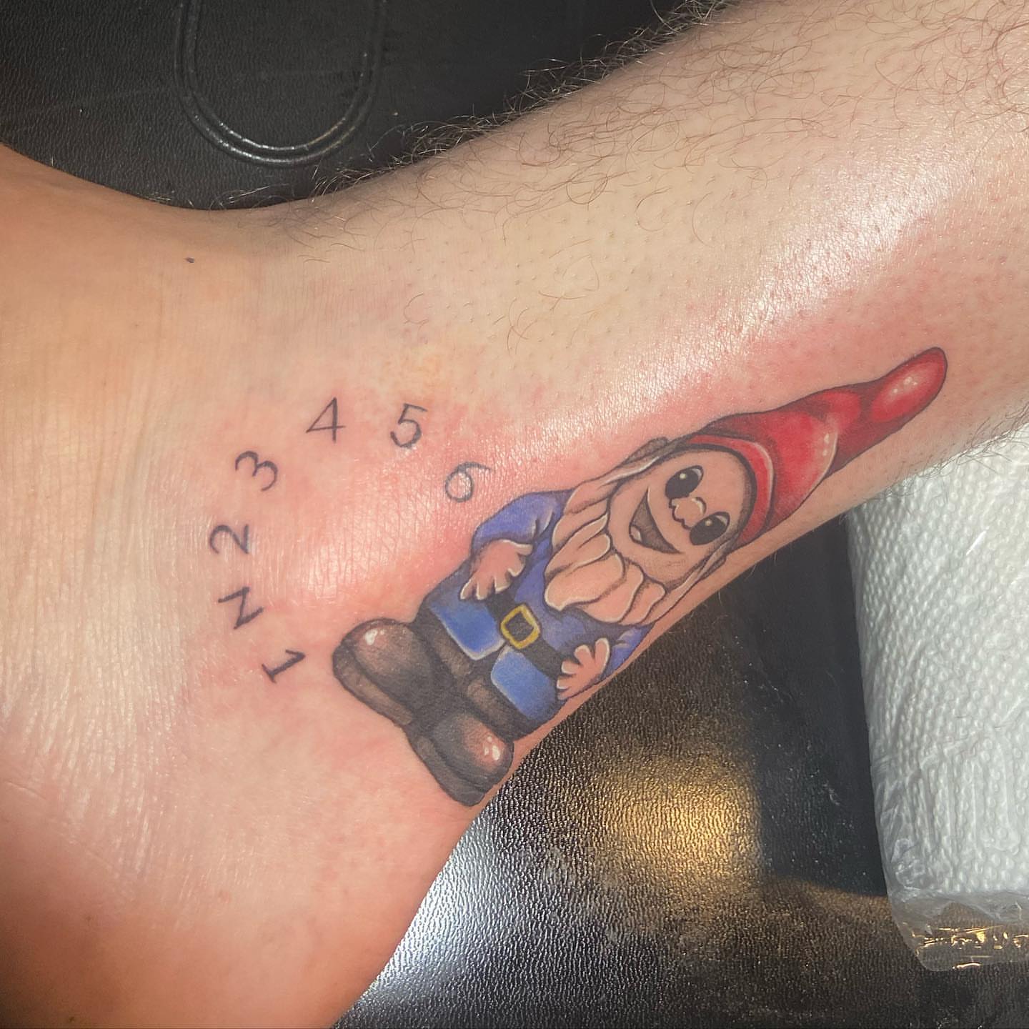 Gnome realism tattoo on the forearm by Tattoos by Tessa