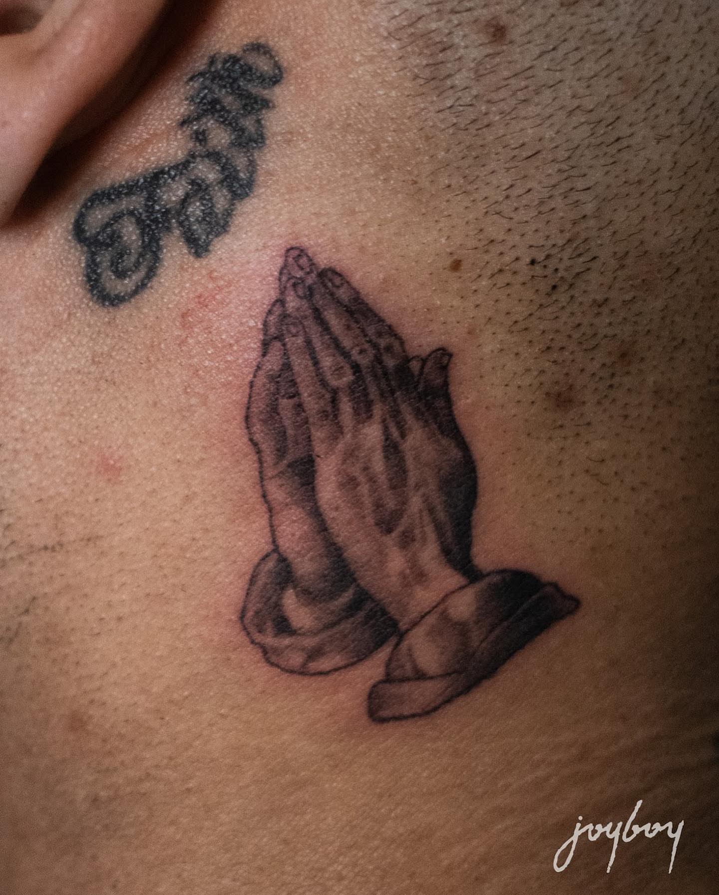 Praying hands black and grey tattoo on the chest by Joel: Boston Tattoo Artist, Boston, Massachusetts