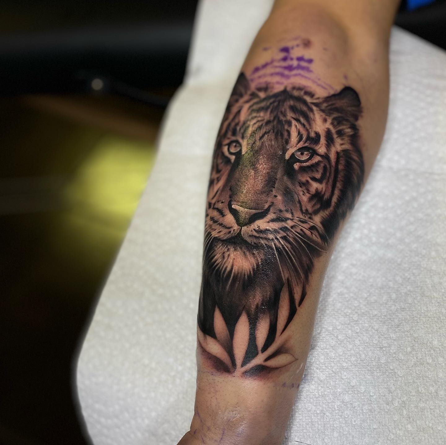 Tiger realism tattoo on the forearm by Amber