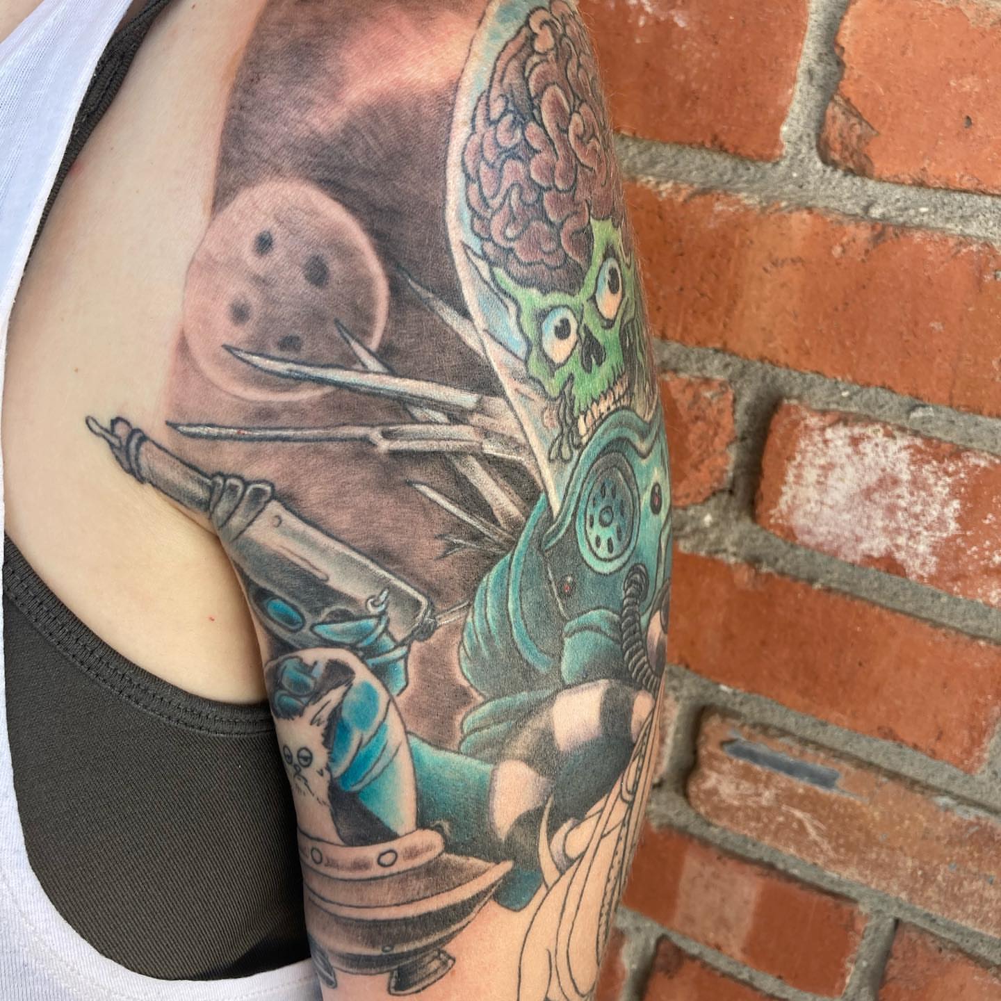 Cyborg skull dotwork tattoo on the upper arm by Chuck House