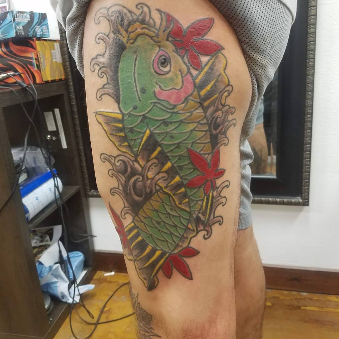 Koi fish American traditional tattoo on the thigh by Rue McLean