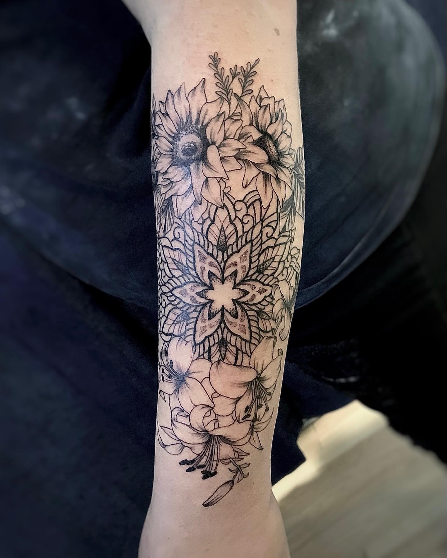 Sunflowers and lilies black and grey tattoo on the forearm by Binn Binn - Houston Tattoo Artist